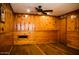 Cozy bedroom with wood paneled walls and hardwood floors at 2157 W Mulberry Dr, Phoenix, AZ 85015