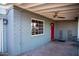 Covered patio with red door and gray brick exterior at 2157 W Mulberry Dr, Phoenix, AZ 85015