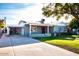 Gray house with red door, carport, and nicely landscaped yard at 2157 W Mulberry Dr, Phoenix, AZ 85015