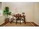 Bright home office features a wood desk, chair, and rich wood floors at 2157 W Mulberry Dr, Phoenix, AZ 85015