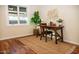 Home office with wood desk, chair, and large window at 2157 W Mulberry Dr, Phoenix, AZ 85015