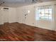 Hardwood floors and large windows in bright living room at 2157 W Mulberry Dr, Phoenix, AZ 85015