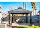 Relaxing patio area with covered gazebo and comfortable seating at 2157 W Mulberry Dr, Phoenix, AZ 85015