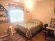 Cozy bedroom with a double bed, window, and workspace at 2400 E Baseline Ave # 282, Apache Junction, AZ 85119