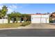 Charming single-story home with a covered patio and well-manicured lawn at 2604 E Downing Cir, Mesa, AZ 85213