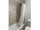 Clean bathroom with shower/tub combo and hexagon tile accent at 2802 N 50Th Ln, Phoenix, AZ 85035