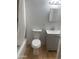 Updated bathroom with gray vanity, and a white toilet and bathtub at 2802 N 50Th Ln, Phoenix, AZ 85035