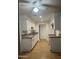 Clean galley kitchen featuring white cabinets and granite countertops at 2802 N 50Th Ln, Phoenix, AZ 85035