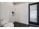 Modern bathroom with white tile, hex floor, and black fixtures at 2928 E Cortez St, Phoenix, AZ 85028