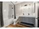 Bathroom with marble tile, double vanity and tub at 2928 E Cortez St, Phoenix, AZ 85028