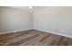 Bright bedroom with wood-look flooring and ceiling fan at 2928 E Cortez St, Phoenix, AZ 85028