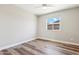 Well-lit bedroom featuring wood-look floors and a window at 2928 E Cortez St, Phoenix, AZ 85028