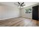 Bright bedroom with ceiling fan and wood-look floors at 2928 E Cortez St, Phoenix, AZ 85028