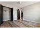Bedroom with built-in closet and wood-look floors at 2928 E Cortez St, Phoenix, AZ 85028