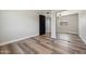 Bedroom with mirrored closet doors and wood-look floors at 2928 E Cortez St, Phoenix, AZ 85028