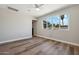 Spacious bedroom featuring large window and wood-look floors at 2928 E Cortez St, Phoenix, AZ 85028