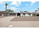 White single story home with gray garage door and modern fence at 2928 E Cortez St, Phoenix, AZ 85028