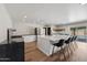 Modern kitchen with white cabinets, large island, and stainless steel appliances at 2928 E Cortez St, Phoenix, AZ 85028