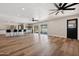 Spacious living area with hardwood floors, ceiling fans, and sliding glass doors at 2928 E Cortez St, Phoenix, AZ 85028
