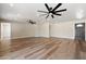 Bright living room with hardwood floors and two ceiling fans at 2928 E Cortez St, Phoenix, AZ 85028