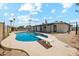 Inviting kidney-shaped pool with diving board in sunny backyard at 2928 E Cortez St, Phoenix, AZ 85028