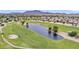 Aerial view of golf course, lake, and community at 3056 E Palm Beach Dr, Chandler, AZ 85249