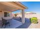 Covered patio and gravel backyard with desert landscaping at 3056 E Palm Beach Dr, Chandler, AZ 85249