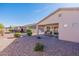 Spacious backyard with covered patio and gravel landscaping at 3056 E Palm Beach Dr, Chandler, AZ 85249