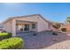 Landscaped backyard with covered patio and gravel at 3056 E Palm Beach Dr, Chandler, AZ 85249