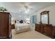 Bright bedroom with ceiling fan and wood furniture at 3056 E Palm Beach Dr, Chandler, AZ 85249