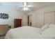 Bright bedroom with a queen-size bed and ceiling fan at 3056 E Palm Beach Dr, Chandler, AZ 85249