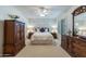 Spacious bedroom with wood furniture and ceiling fan at 3056 E Palm Beach Dr, Chandler, AZ 85249
