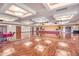 Large community room with hardwood floors and a stage at 3056 E Palm Beach Dr, Chandler, AZ 85249
