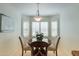 Charming dining area with wood table and window seating at 3056 E Palm Beach Dr, Chandler, AZ 85249