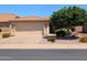 Inviting home featuring a spacious driveway leading to a two-car garage, complemented by desert-friendly landscaping at 3056 E Palm Beach Dr, Chandler, AZ 85249