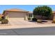 Lovely home boasts a wide driveway and well-maintained xeriscaped front yard, perfect for low-maintenance living at 3056 E Palm Beach Dr, Chandler, AZ 85249
