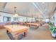 Game room features multiple billiard tables and comfortable seating at 3056 E Palm Beach Dr, Chandler, AZ 85249