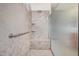 Clean bathroom with a walk-in shower and tiled walls at 3082 E Jade Ct, Chandler, AZ 85286