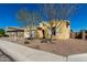 Tan home with two-car garage and front yard at 3082 E Jade Ct, Chandler, AZ 85286