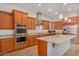 Gourmet kitchen with granite countertops and stainless steel appliances at 3082 E Jade Ct, Chandler, AZ 85286