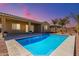 Inviting backyard pool with covered patio and desert landscaping at 3082 E Jade Ct, Chandler, AZ 85286