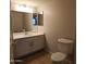 Clean bathroom with single vanity and updated toilet at 3301 E Earll Dr # 107, Phoenix, AZ 85018