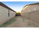 Small, unlandscaped backyard with block wall and gated access at 333 N Calle Largo --, Mesa, AZ 85207
