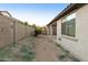 Small backyard with dirt and sparse desert landscaping at 333 N Calle Largo --, Mesa, AZ 85207