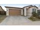 Front view of a house with a brown garage door and neutral siding at 333 N Calle Largo --, Mesa, AZ 85207