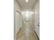 Long hallway with tile floors and neutral walls at 333 N Calle Largo --, Mesa, AZ 85207