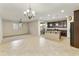 Open concept kitchen and dining area with tile flooring and a chandelier at 333 N Calle Largo --, Mesa, AZ 85207