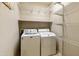 Laundry room with washer, dryer, and ample shelving at 333 N Calle Largo --, Mesa, AZ 85207