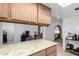 Kitchen with wood cabinets, stainless steel appliances, and breakfast bar at 402 E South Ave, Buckeye, AZ 85326