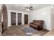 Living room with brown couch and brick archway at 402 E South Ave, Buckeye, AZ 85326